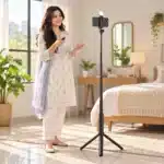 R16S Selfie Stick Lifestyle Content creator filming with the R16S selfie stick tripod and wireless remote at home