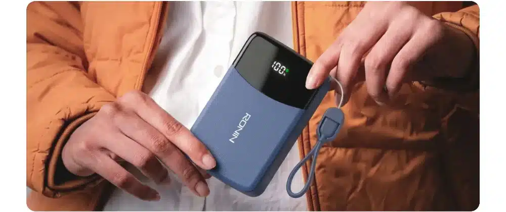 Ronin Cyan R-4075 10000Mah Power Bank 3 Ronin R-4075 power bank in hand with attached Type-C cable