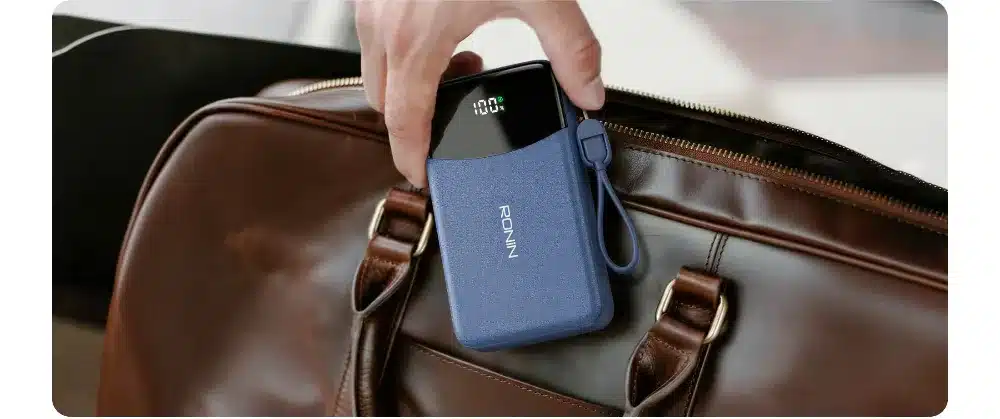 Ronin Cyan R-4075 10000Mah Power Bank 5 Ronin R-4075 power bank going into a bag